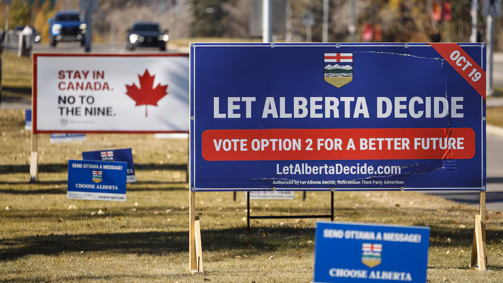 Competing referendum signs line a boulevard in Calgary, Thursday, Oct. 15, 2026. THE CANADIAN PRESS/Jeff McIntosh